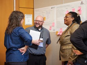Course & Program Grants 2023, grants for faculty, grants for HBCU faculty; photo of Course & Program Grants recipients collaborating in front of a whiteboard at OPEN 2023 conference