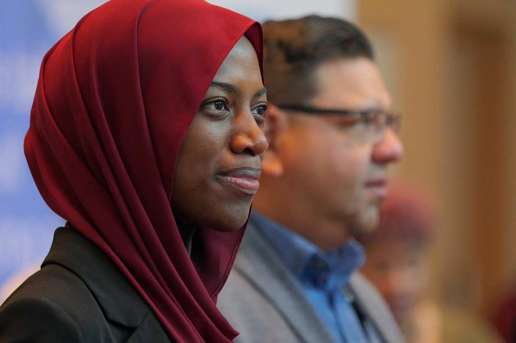 VIA Summit; photo of two attendees at a past event smiling