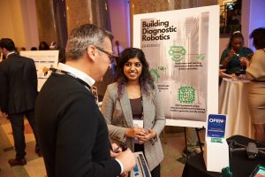 OPEN 2023 recap; attendees at a past poster session